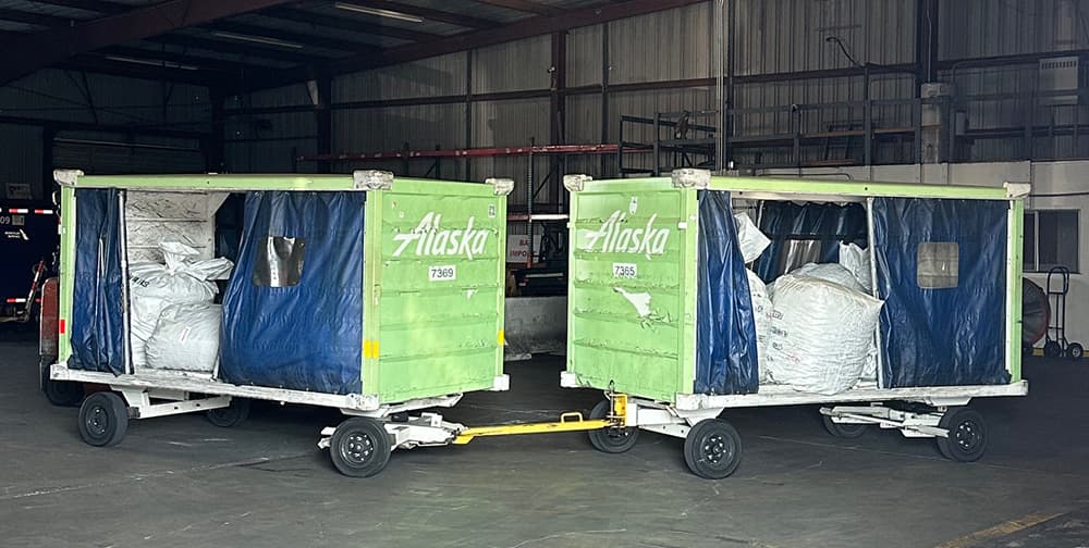 Bags of hops on Alaska Air Cargo carts
